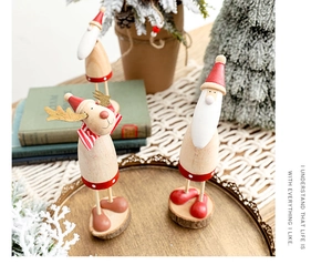 Cozy Christmas scene with wooden Santa and reindeer figurines on vintage books
