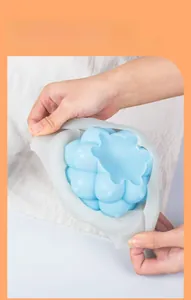 Close-up showing flexible blue silicone mold durability for DIY spherical candle making