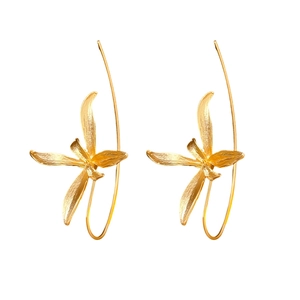 Golden orchid-shaped drop earrings with long curved hooks on a clean white background