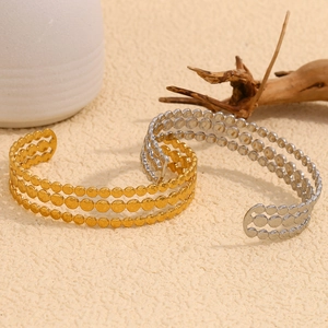 Three-layer disc open cuff bracelets in 18K gold and silver plating on textured surface