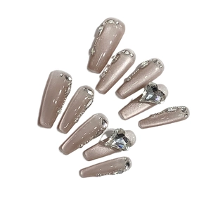 Handmade long coffin cat eye press-on nails in nude shimmer with crystal heart accents