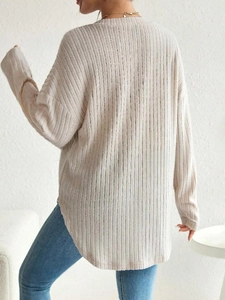 Back view of a ribbed long sleeve maternity shirt in beige with drop shoulder design