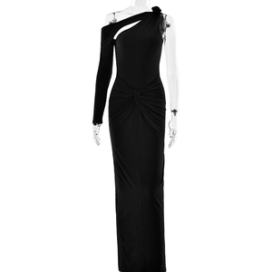 Detail of elegant black one-shoulder dress with sexy cutout and waist pleats