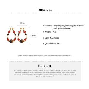 Detailed chart showing size and materials of tiger eye stone and pearl beaded earrings