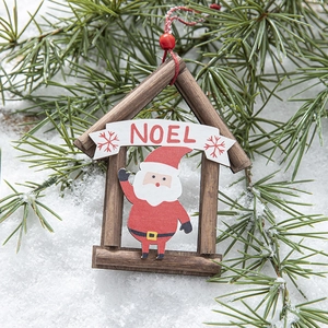 Wooden Christmas cabin ornament with Noel banner and Santa Claus on snowy pine branch