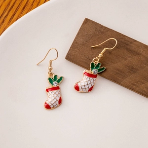 Detail of Christmas stocking earrings with red enamel and white rhinestone on a hook