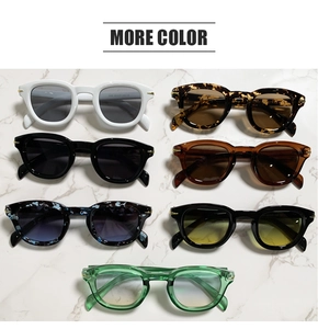 Multiple stylish retro square sunglasses in various colors on marble surface