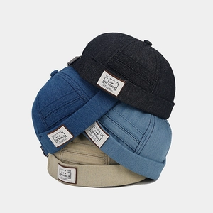 Retro denim docker hats in four colors with embroidered letter patches on the side