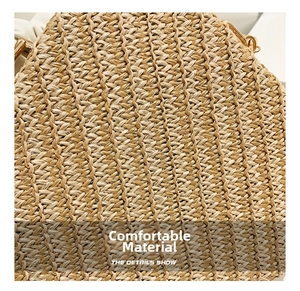 Close-up of woven straw texture with elegant golden metal buckle on shell handbag