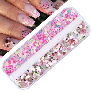 Detail of 12-grid nail art sequins box featuring laser heart shapes and glitter colors