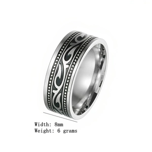 Close-up detail of 8mm vintage titanium steel ring featuring black tribal etched pattern