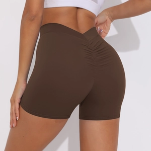 Close-up of high-waist scrunch yoga shorts with V-shaped back seam in dark brown color