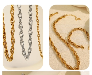 Detail of twisted rope chain necklace and bracelet in gold and silver finish with lobster clasp