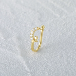 Detailed view of a gold S925 silver nose cuff featuring a sparkling moon and star motif