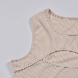 Close-up of beige ribbed knit bodysuit with u-neck and chest cutout detail