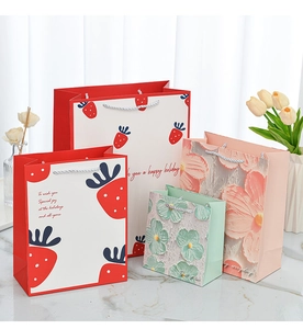 Detail showing high-quality handle rope and print textures on various cartoon gift bags