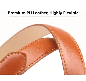 Detail of brown PU leather belt showing lychee texture and yellow stitching