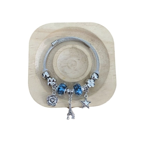 Silver beaded bracelet with blue floral glass beads and Eiffel Tower rose charms