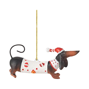 Close-up of Dachshund Christmas ornament with red sweater and festive golden string