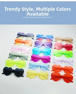 Flat lay display of heart shaped rimless sunglasses in 18 vibrant candy color options