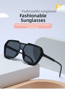 Close-up of black oversized wrap-around sunglasses with GYNE logo and sleek modern design