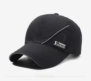 Detail of breathable mesh fabric on black sports cap with reflective piping and side text