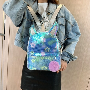 Girl's unicorn backpack with teal sequins, star patterns, and a purple pom-pom charm