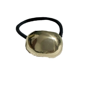 Golden metal accent elastic hair tie for ponytail, minimalist black rubber band accessory