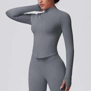 Detail of ribbed fabric texture and thumb holes on long sleeve yoga sports jacket