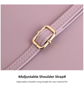 Close-up of adjustable purple leather shoulder strap with gold-tone metal buckle detail