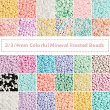 Macro shot of 2mm 3mm 4mm matte seed beads in various pastel colors for DIY jewelry making