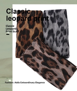 Close-up of lightweight classic leopard print scarves in brown and grey tones
