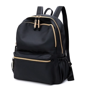 Classic black oxford fabric backpack for women with stylish gold-tone zippers and side pockets