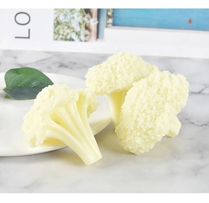 Detailed realistic artificial cauliflower model with texture on marble background