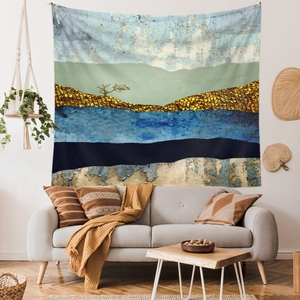 Detailed texture of abstract landscape tapestry with gold leaf accents and lock-edge finish