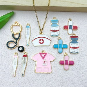 Detailed set of 12 enamel medical charms including nurse hat, stethoscope and thermometer