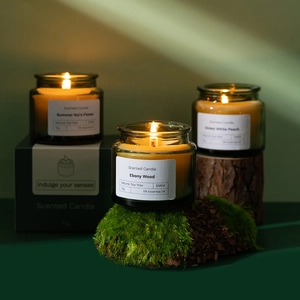 70g soy wax scented candles in amber glass jars with essential oils on wood base