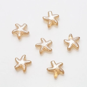 Detailed view of starfish glass beads with textured gradient brown finish for DIY jewelry