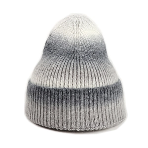 Detailed view of the thick ribbed texture and grey gradient knit of this warm winter hat