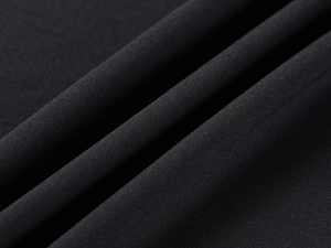 Close-up of black high-elastic fabric texture showing fine weave and soft drape