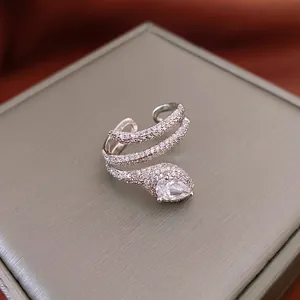 Silver snake-shaped wrap ring with sparkling zircon and pear-cut diamond detail