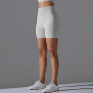 Close-up of high-waist seamless ribbed waistband on light grey yoga shorts for women
