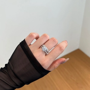 Close-up of a double-layered S925 silver ring set with a brilliant round ice-cut zircon