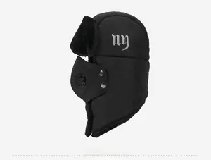 Detail of windproof bomber hat with black faux fur lining and integrated breathing mask