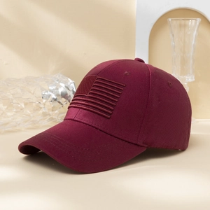 Burgundy baseball cap with American flag embroidery in a stylish 45-degree side view