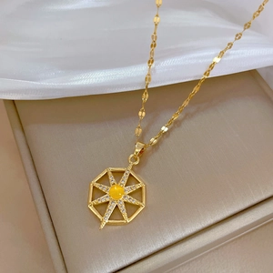 Gold starburst pendant necklace with yellow opal and sparkling sequins chain