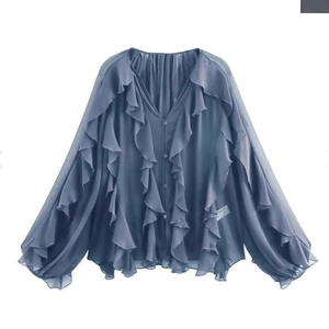Blue-grey long sleeve ruffled V-neck blouse with button closure in a flowing fabric