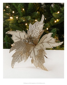 Detail of gold artificial poinsettia with glitter petals on a Christmas tree