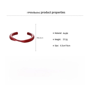 Detail view of red marbled acrylic cuff bracelet showing weight 15.2g and 6.5cm diameter