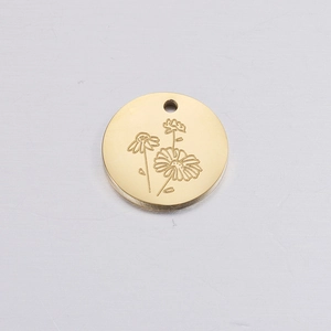 Detailed close-up of a golden round daisy birthday flower charm with a small hanging hole
